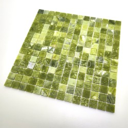 Wall cladding in green stone mosaic for a modern interior